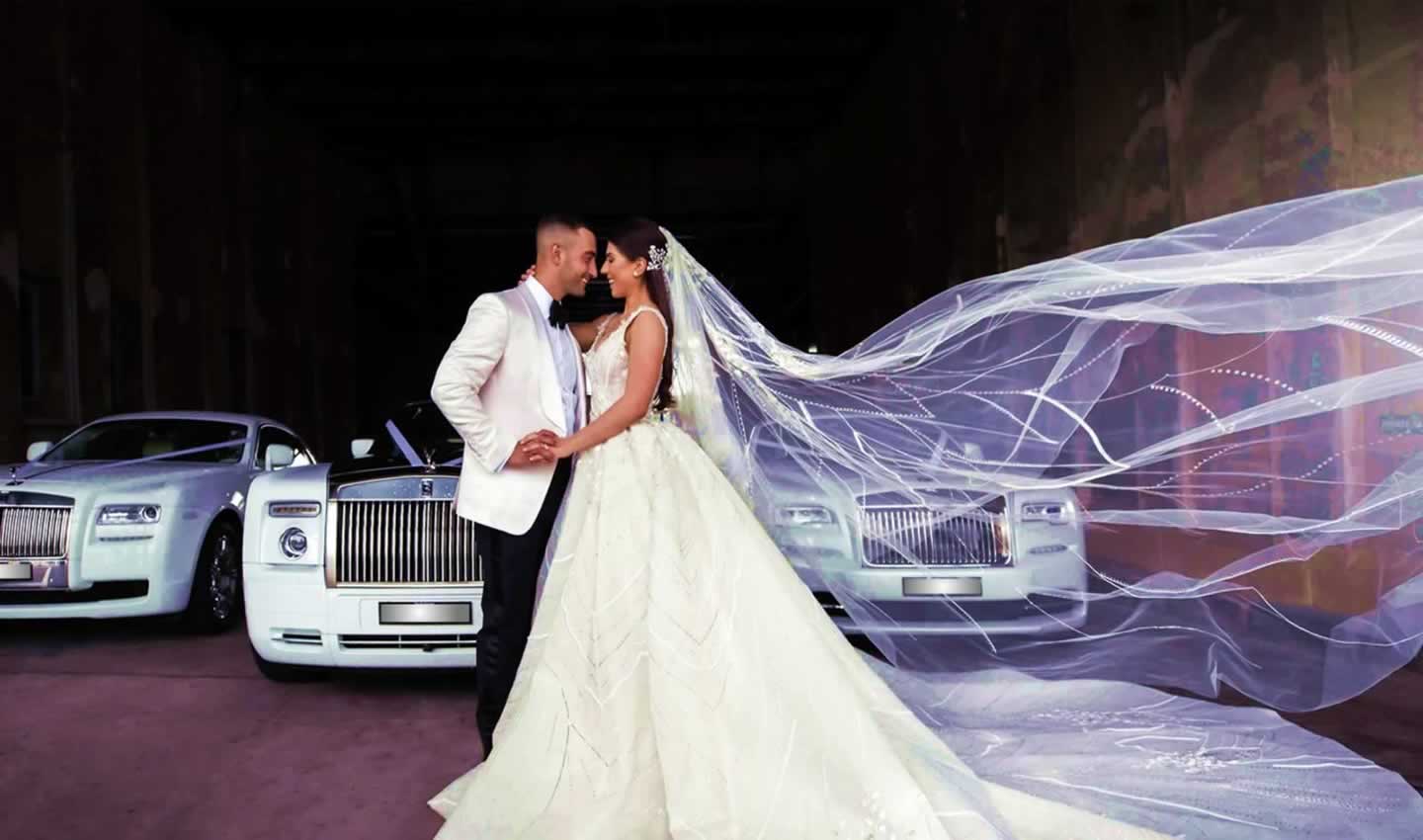 Rolls Royce wedding cars line-up with bride and groom